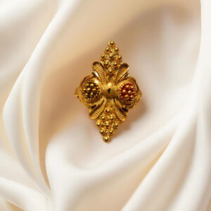 “DivyGold 1 gram gold-plated ornate floral shield ring on cream fabric background”