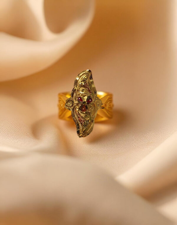 “DivyGold 1 gram gold-polished marquise temple ring with red stone accents on cream satin”