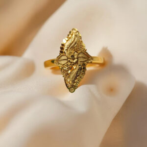 “DivyGold 1 gram gold-polished ethnic leaf motif ring displayed on soft beige fabric background”